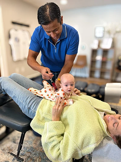 Amyas Kabir Adjusting A Baby Who's Resting on Mom's Belly