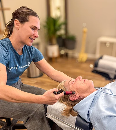 Natalee Olson Uses Instrument on Patient's Jaw